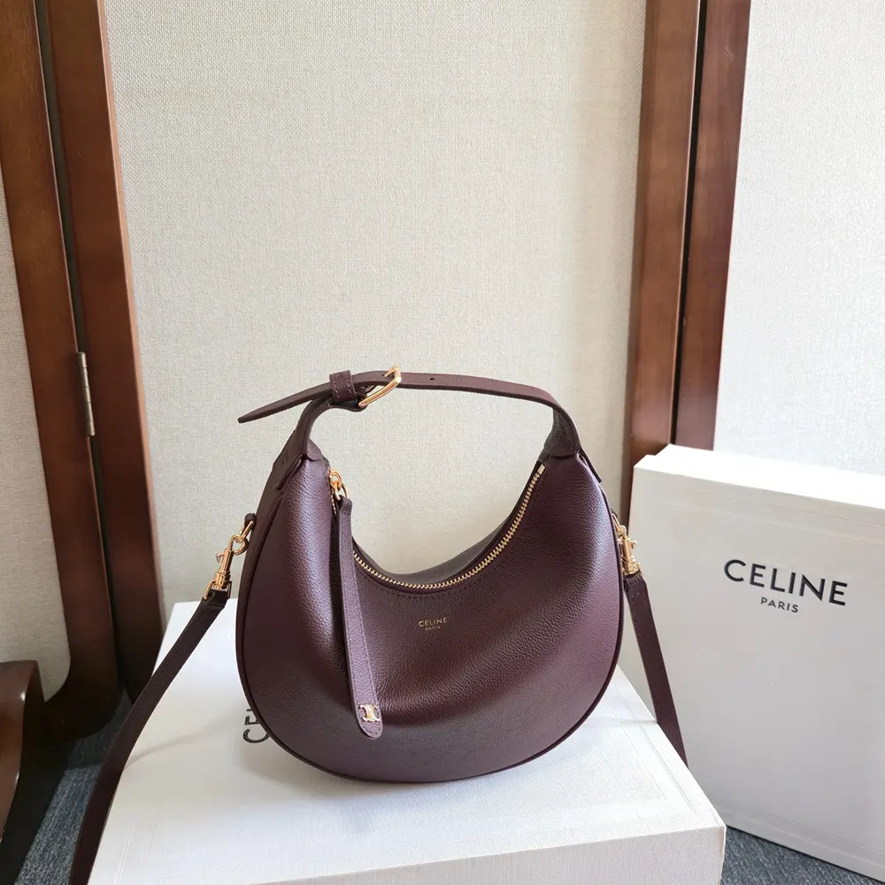Close-up of gold-tone interlocking 'C' on Teen Celine Lulu bag