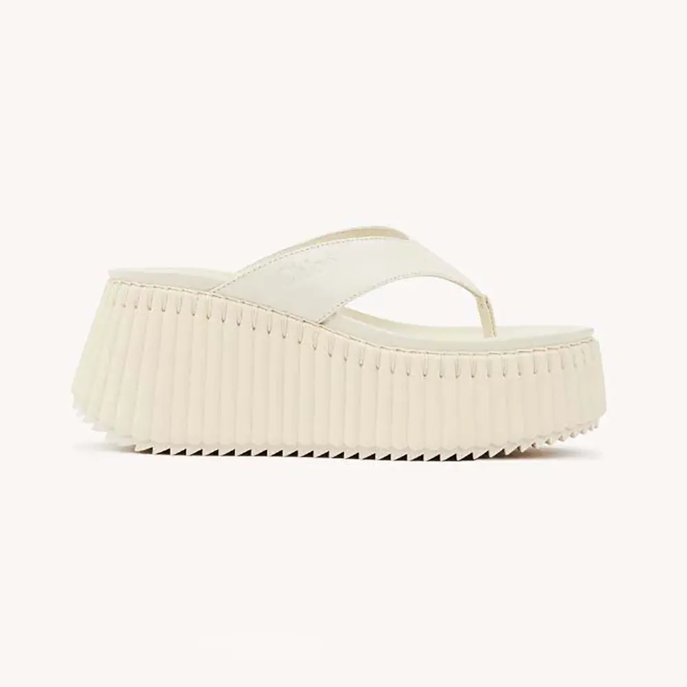Side view of Chloe Women Nama Wedge Slide-White showing wedge heel