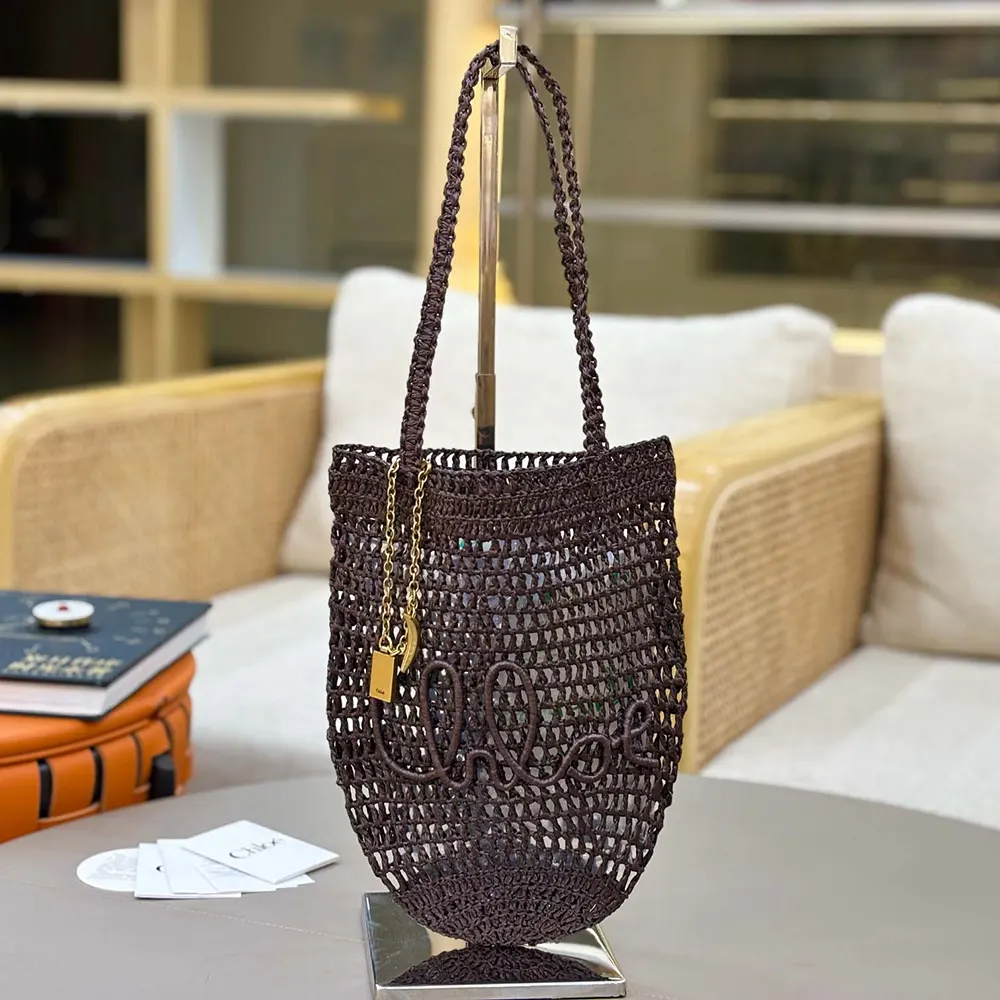 Close-up of raffia weave and gold hardware on Chloe Summer Banana Tote