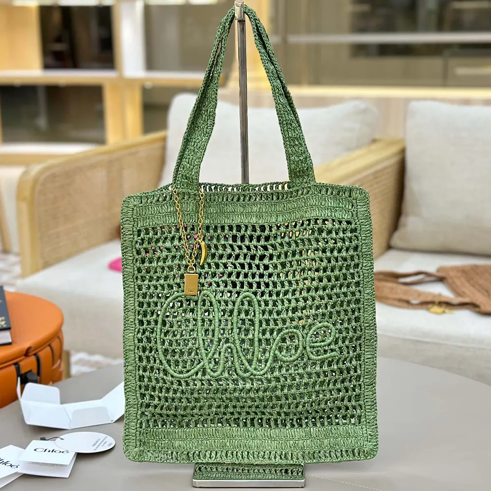 Close-up of green leather trim and gold hardware on Chloe tote