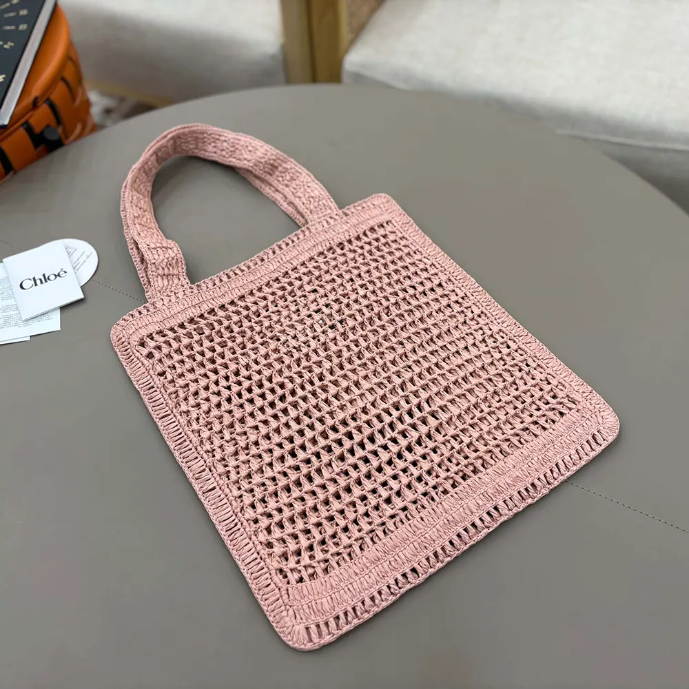 Side angle showing raffia texture on Chloe Women Summer Banana Tote Bag In Raffia-Pink