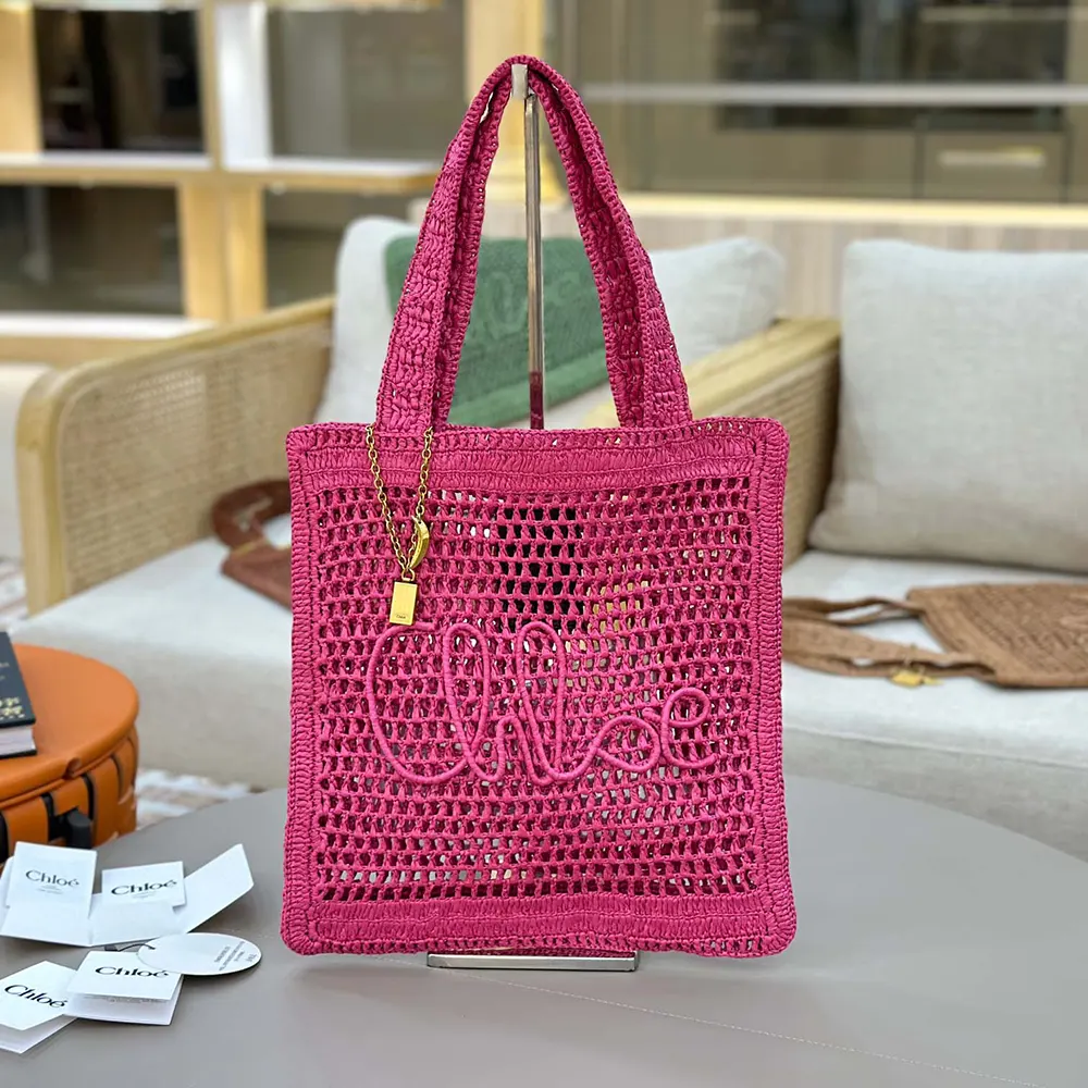 Close-up of gold hardware on Chloe Women Summer Banana Tote Bag In Raffia-Rose