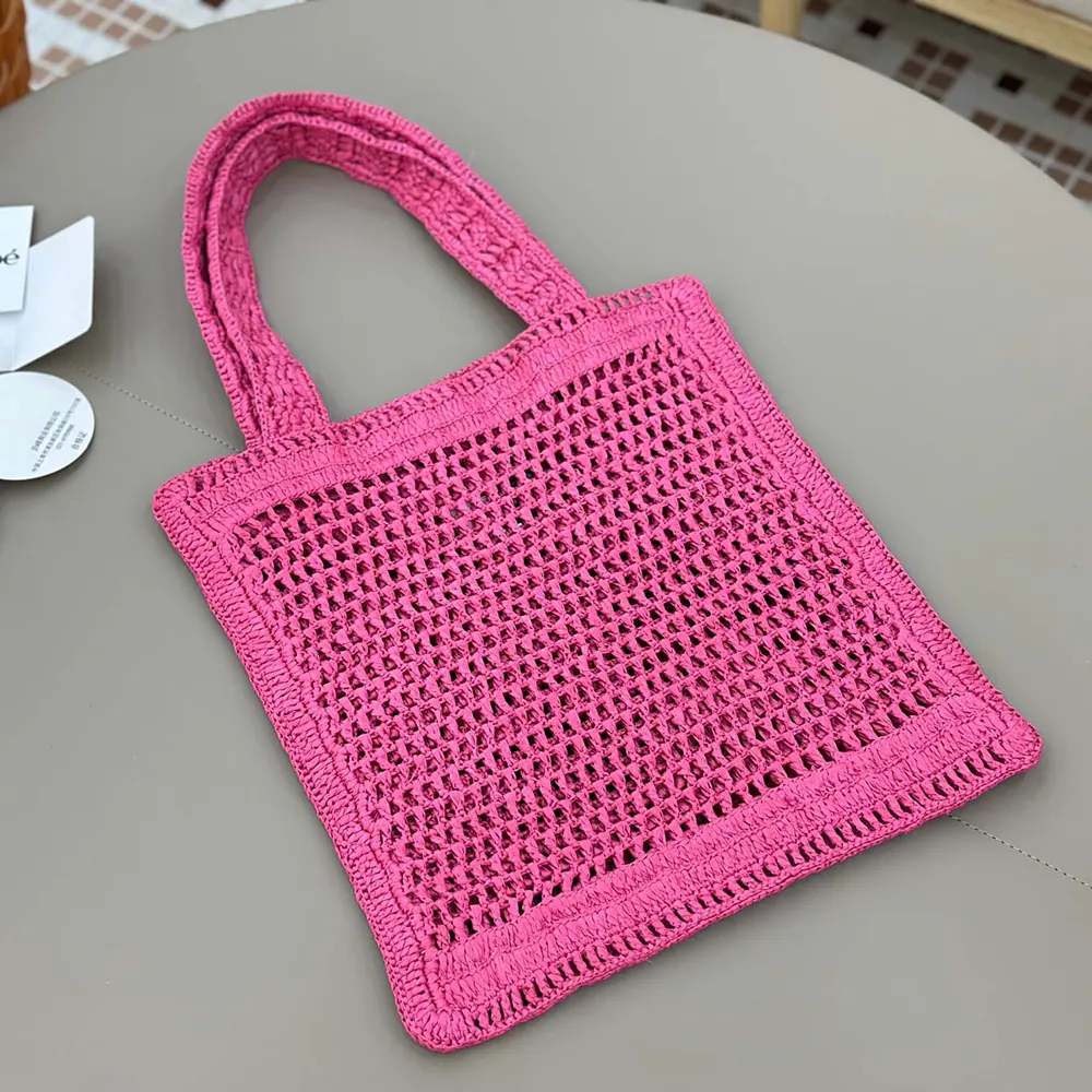 Side angle showing texture of Chloe Women Summer Banana Tote Bag In Raffia-Rose