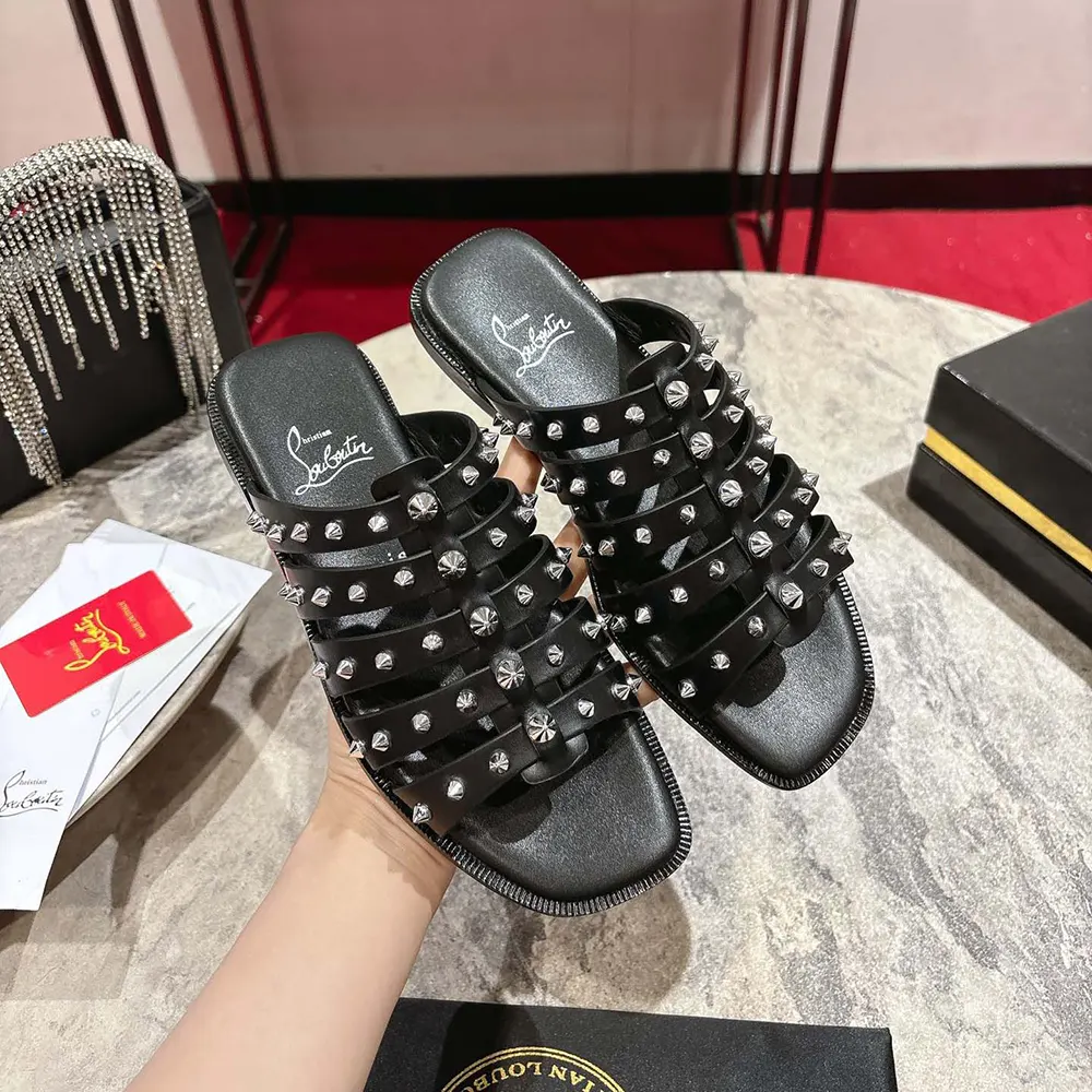 Close-up of waxed calf leather texture on Christian Louboutin Charja Mules