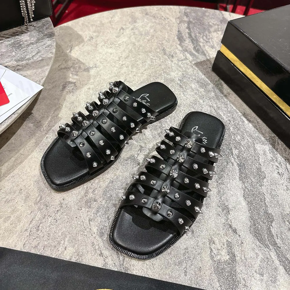 Overhead view highlighting signature red sole of Christian Louboutin Charja Mules