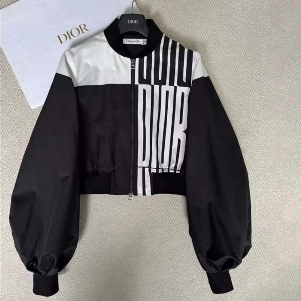 Close-up of black and white jacquard fabric on Dior bomber jacket