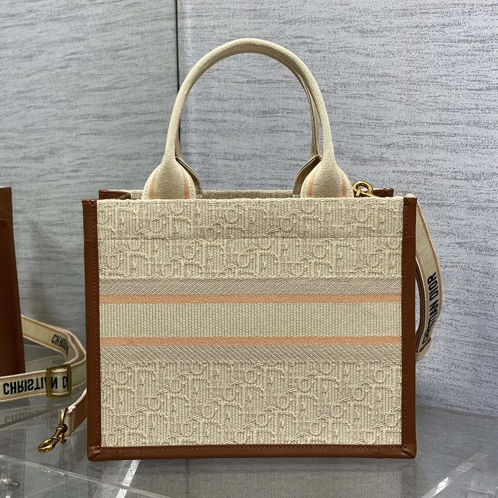 Side angle showcasing silhouette of Dior Women Small Dior Book Tote Beige
