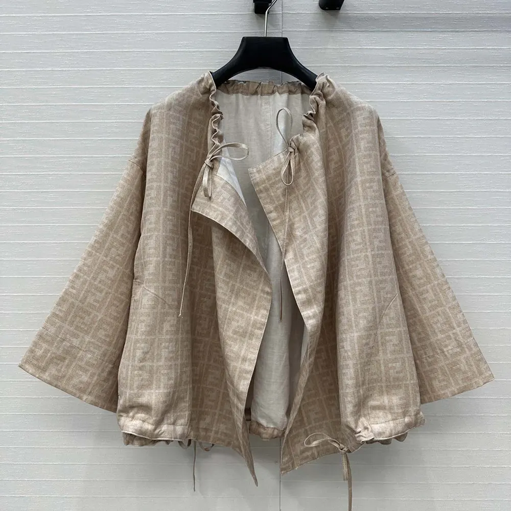 Close-up of gold-tone FF logo buttons on Fendi Women Beige FF Chambray Jacket