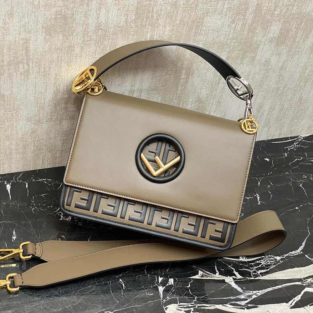 Close-up of signature buckle and gold hardware on Fendi mini-bag
