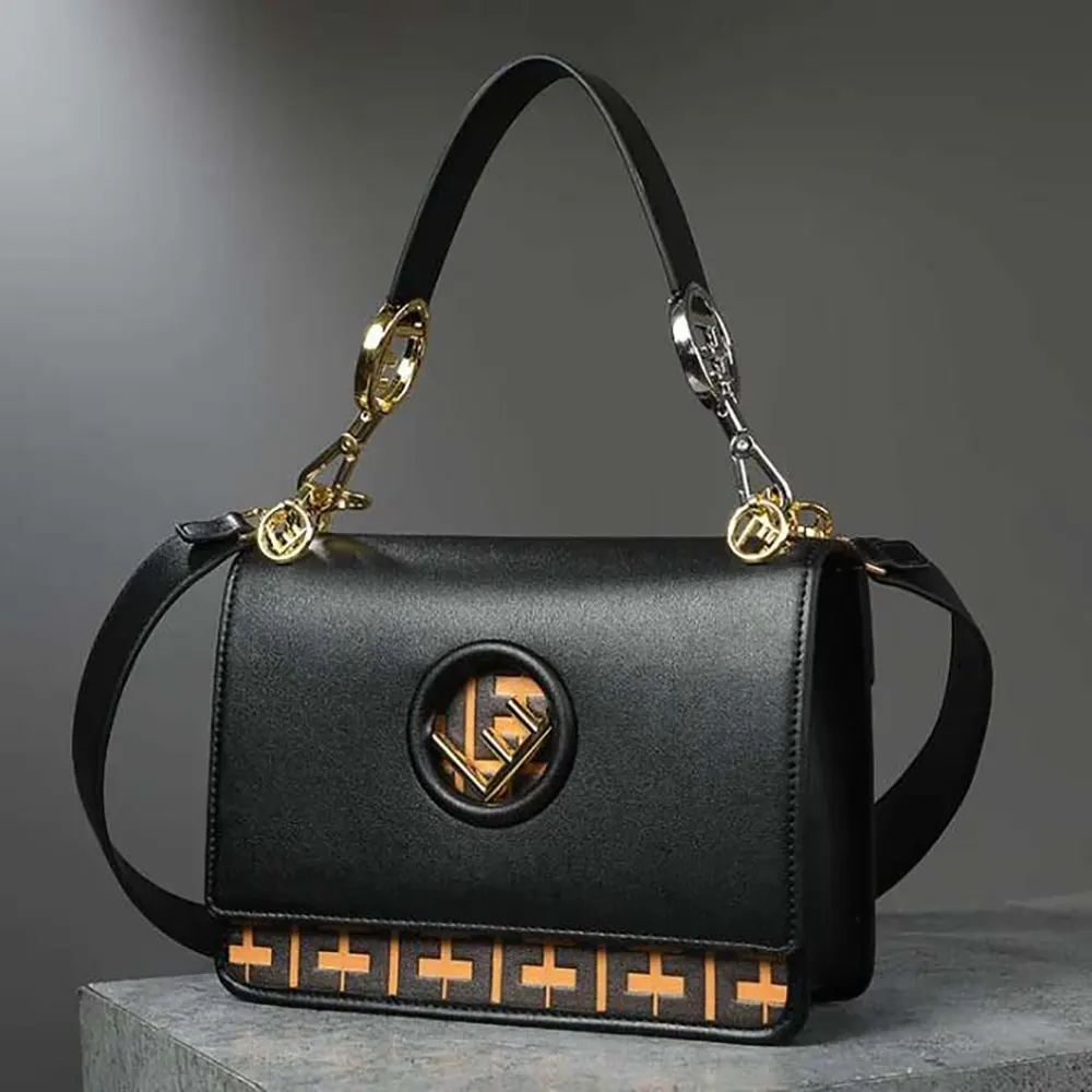 Close-up of gold-tone Fendi buckle on Kan I F Leather Bag, black calfskin