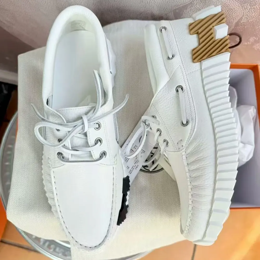 Close-up of white deerskin leather texture on Hermes Men Ketch Sneaker
