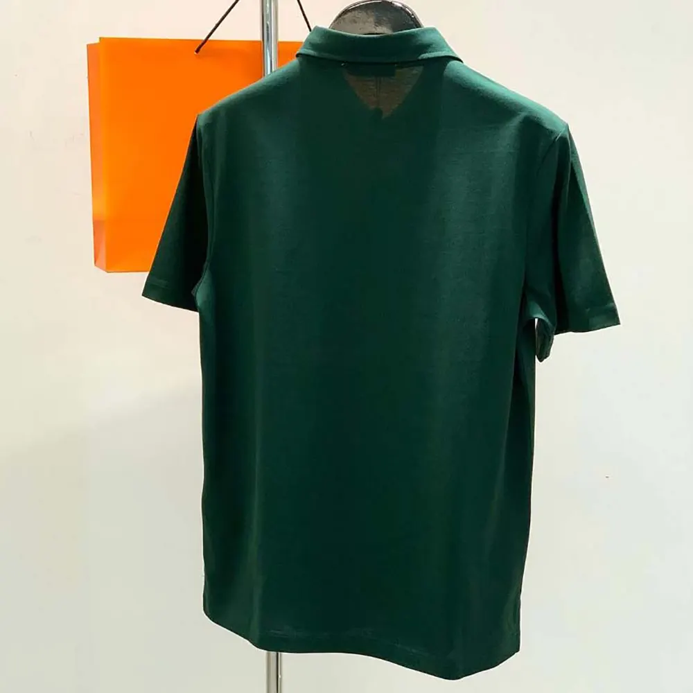 Side angle showing fit of Hermes Men Polo Shirt with Pocket-Dark Green