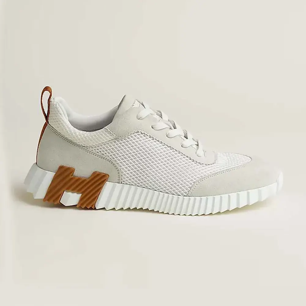 Side profile of Hermes Unisex Bouncing Sneaker in white mesh and suede