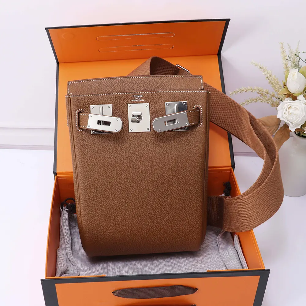 Side view highlighting adjustable straps of Hermes Unisex Hac A Dos PM Backpack-Brown