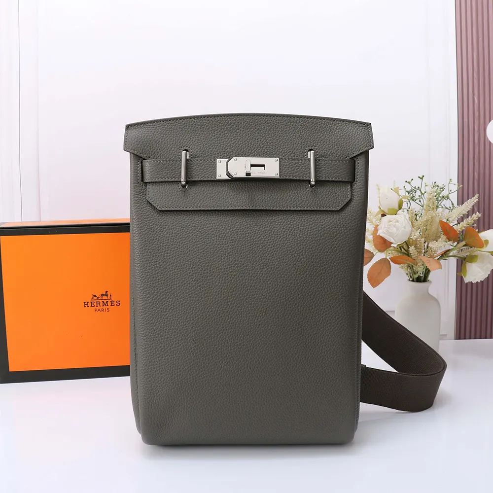 Close-up on dark green leather texture and hardware details