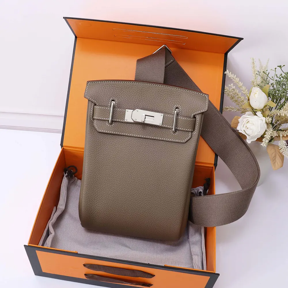 Side angle showing silhouette and adjustable straps of Hermes Unisex Hac A Dos PM Backpack-Grey