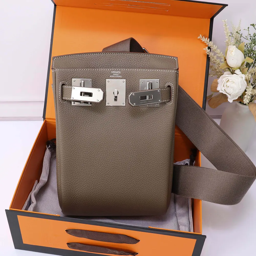 Close-up of silver hardware and zip on Hermes Unisex Hac A Dos PM Backpack-Grey