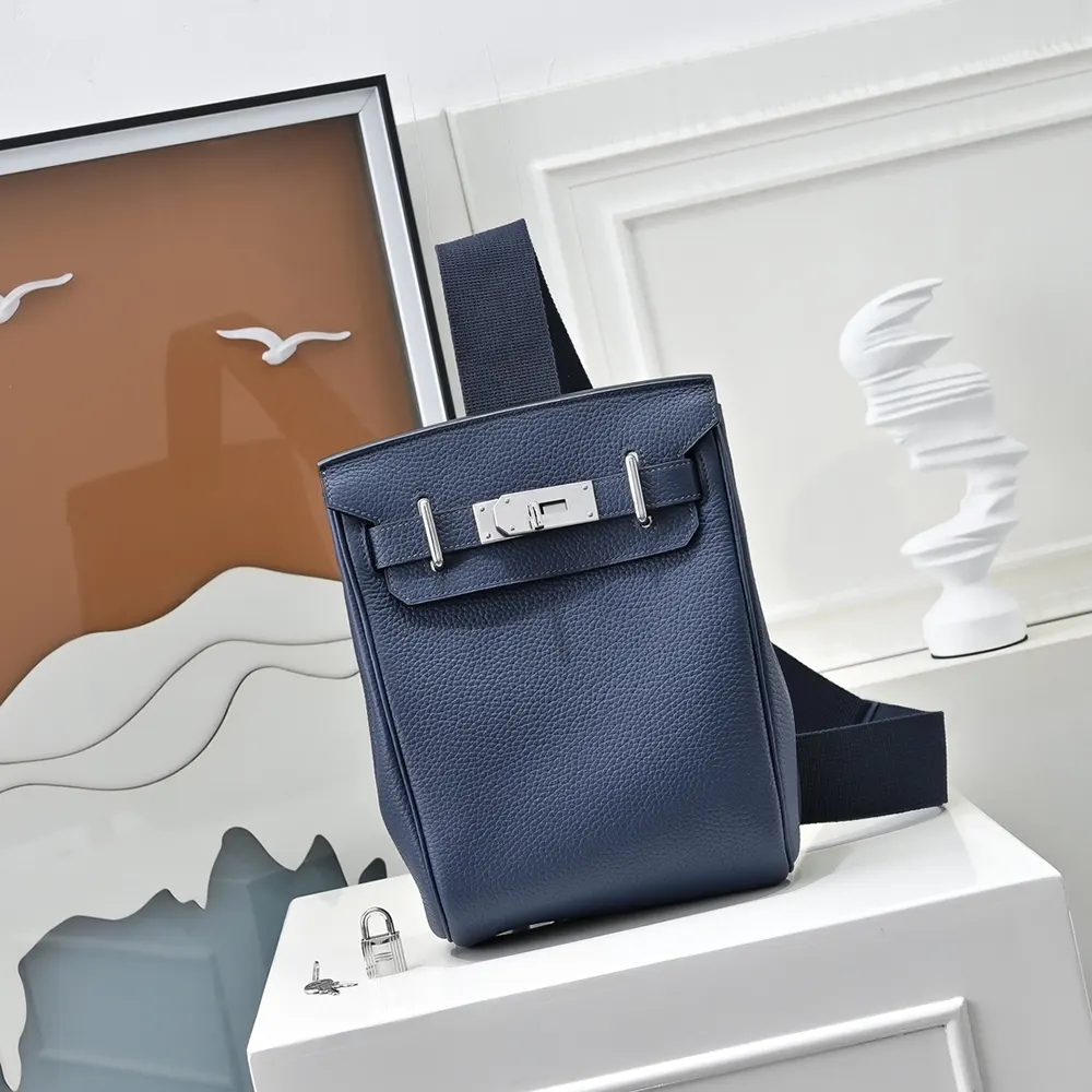 Close-up of silver Hermes hardware on navy leather backpack