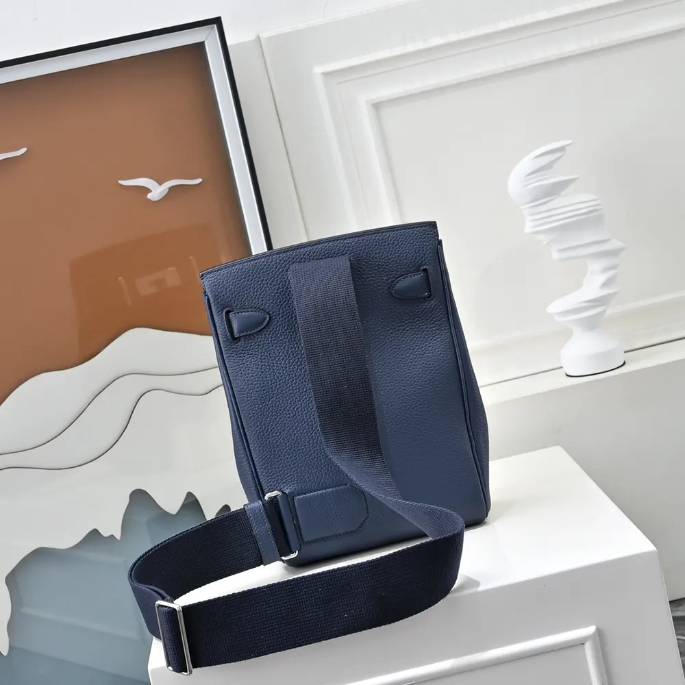 Side angle showing adjustable straps on Hermes Unisex Hac A Dos PM Backpack-Navy