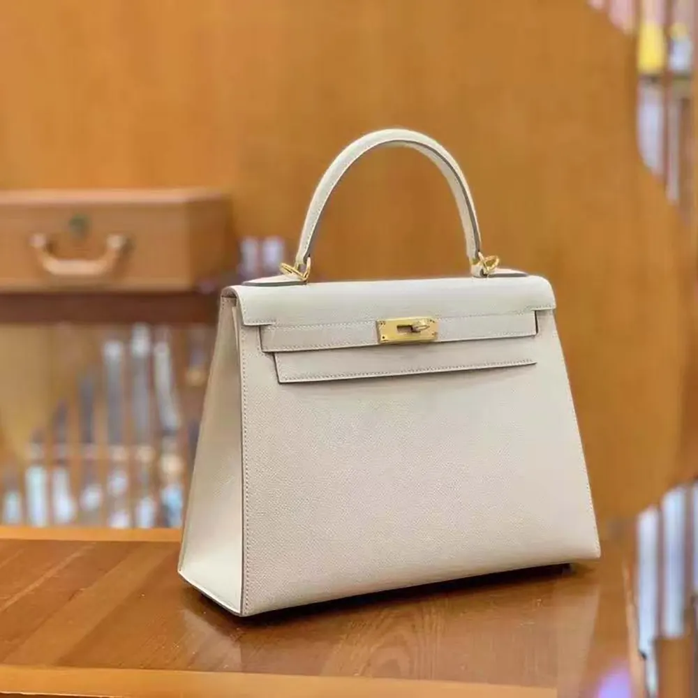Side angle showcasing structured silhouette of Hermes Women Kelly Bag 25