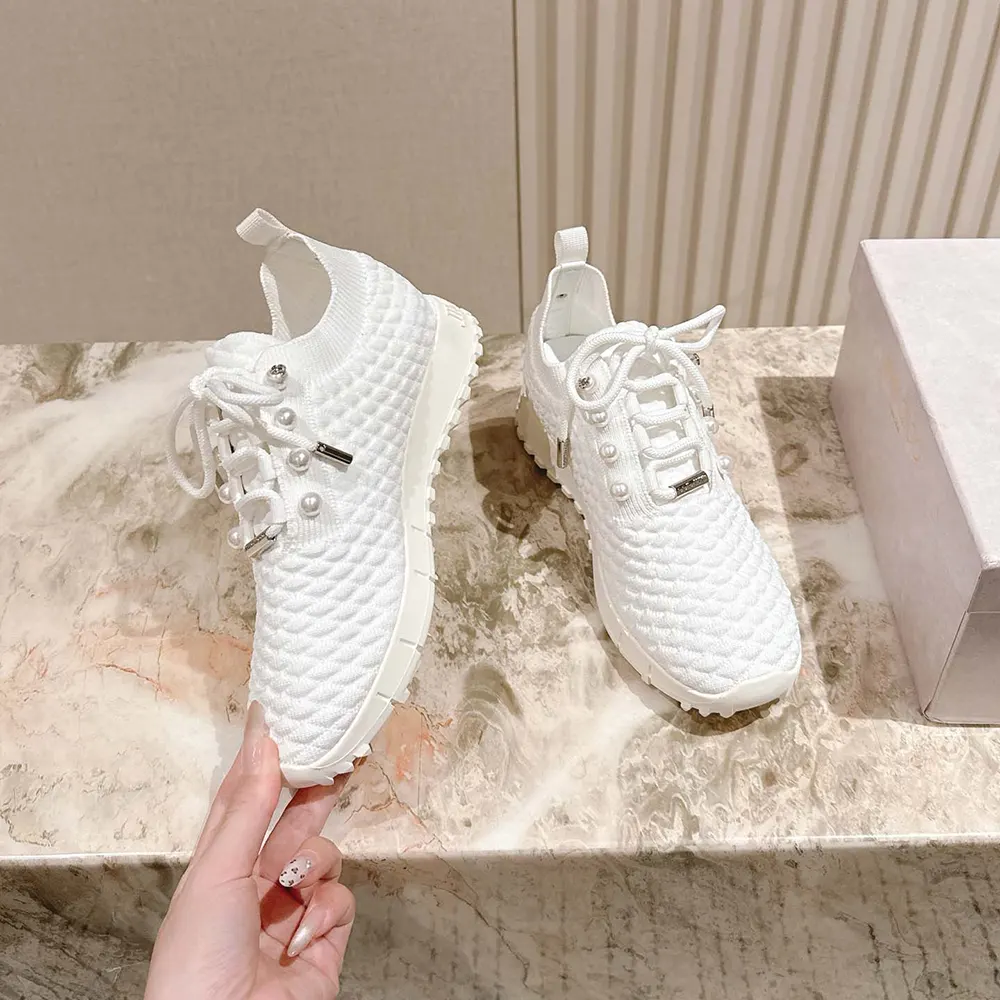 Overhead view showcasing white lace-up and knit detail on Veles trainers