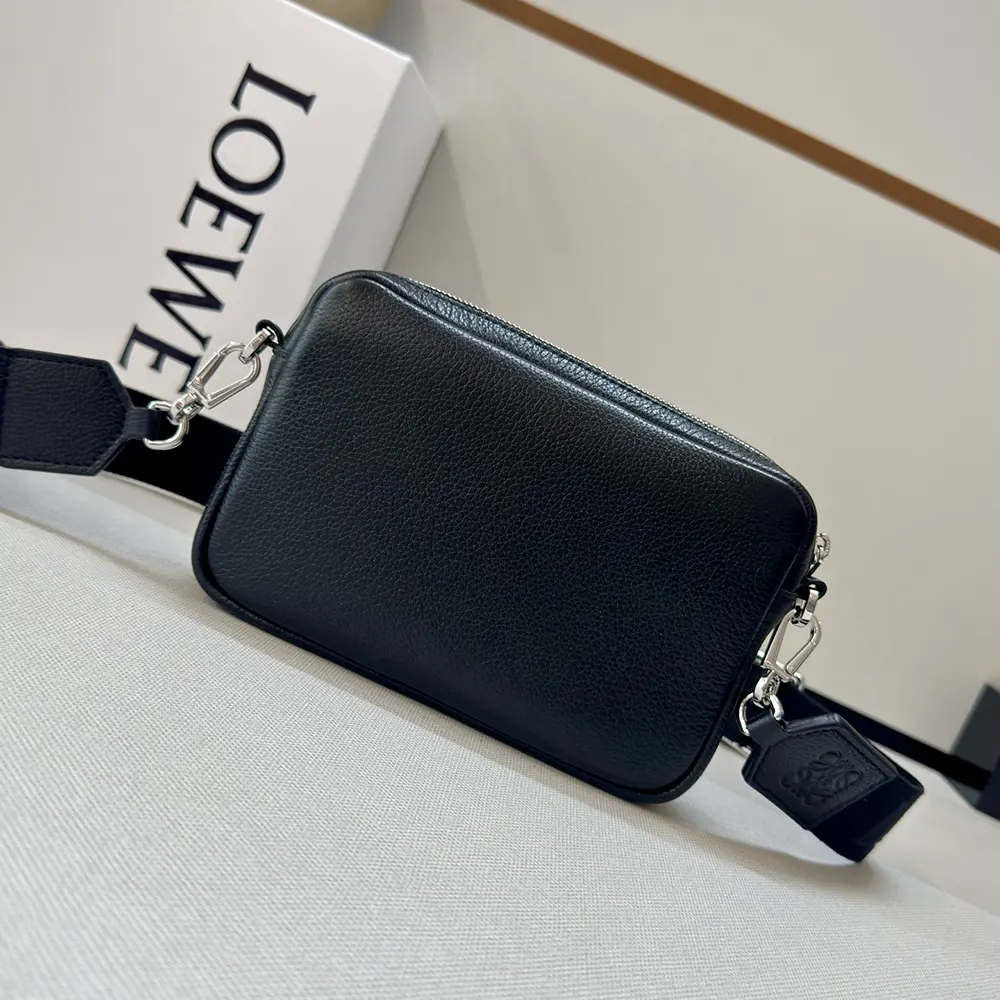 Side angle showing adjustable shoulder strap on Loewe Small Pebble Messenger Bag