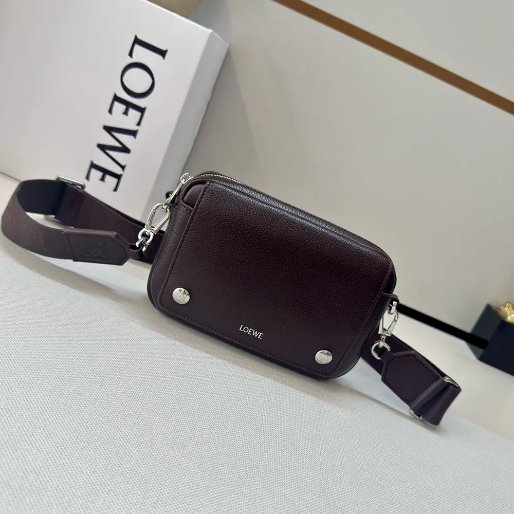 Close-up of pebble grained calfskin texture and silver Loewe hardware