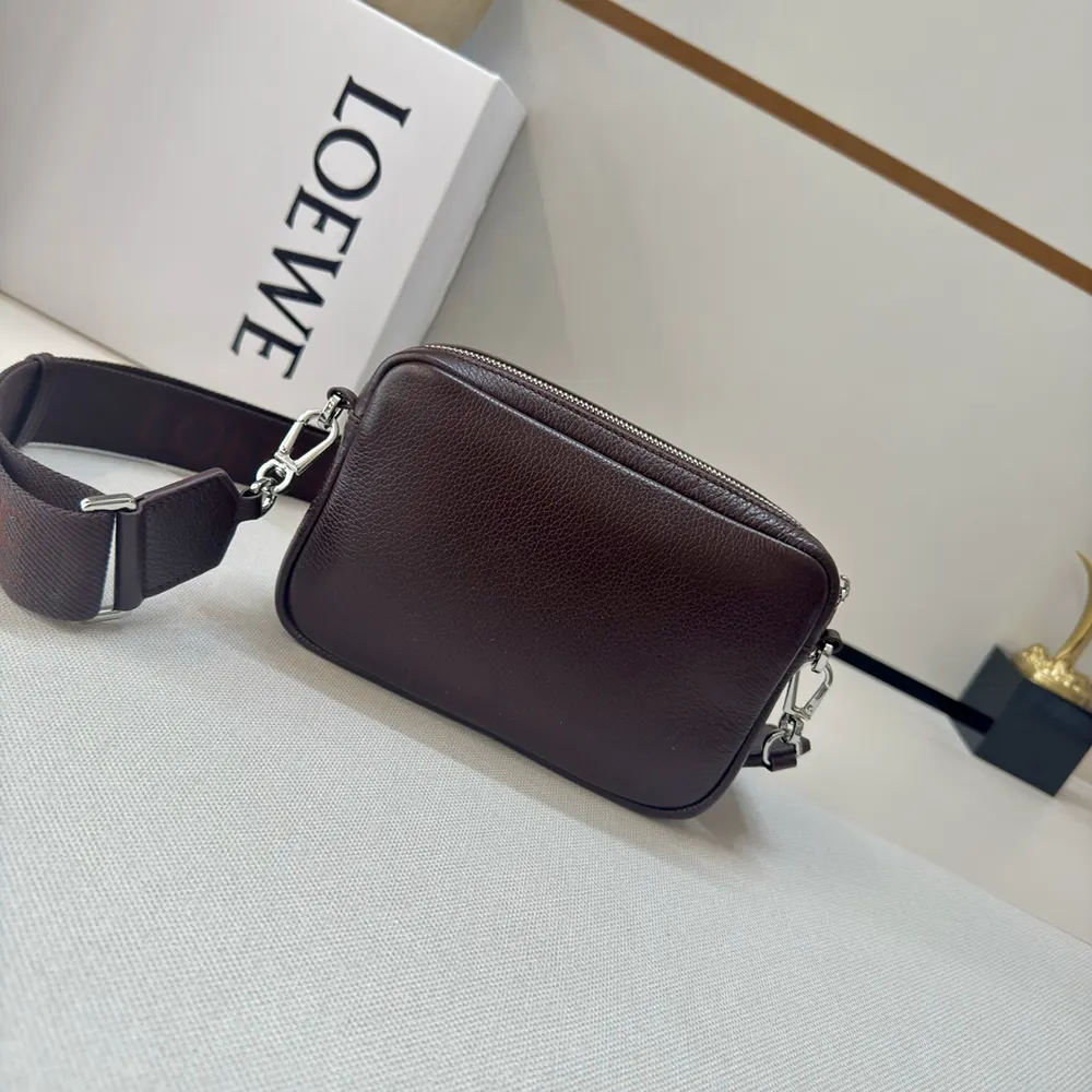 Side angle showing adjustable strap on Loewe Small Pebble Messenger Bag
