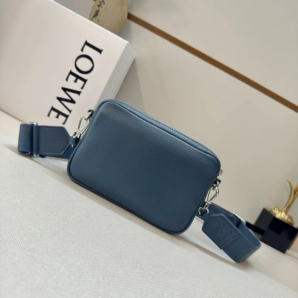 Side profile highlighting adjustable strap of Loewe Small Pebble Messenger Bag