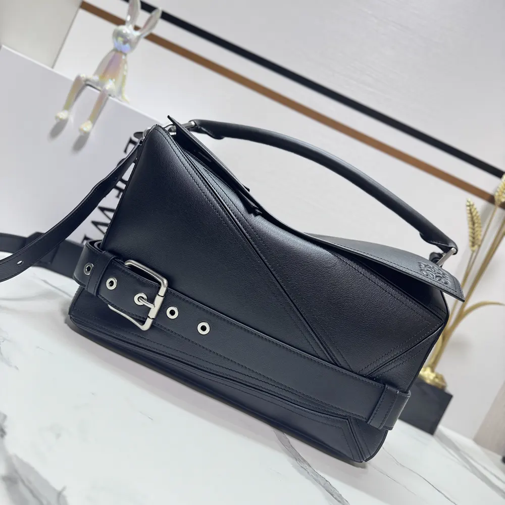 Close-up of matte black hardware on Loewe Unisex Small Puzzle Biker Bag-Black