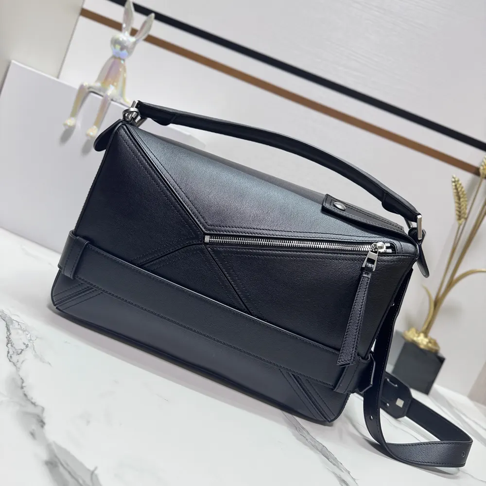 Side angle highlighting curved silhouette of Loewe Unisex Small Puzzle Biker Bag-Black