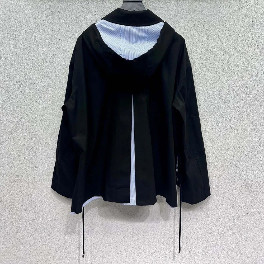 Side profile showing relaxed fit of Loewe Men Hooded Parka in Cotton-Black