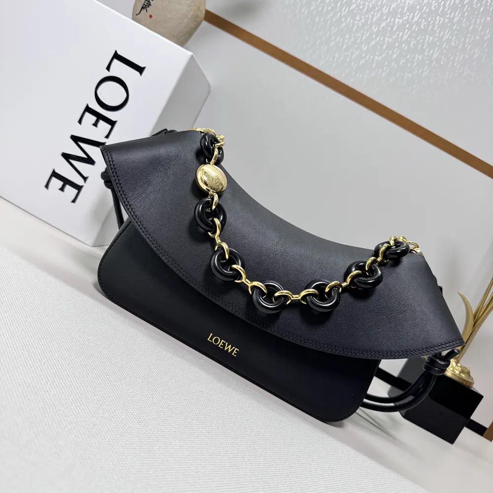 Close-up on polished silver hardware of Loewe Women Medium Ola Bag