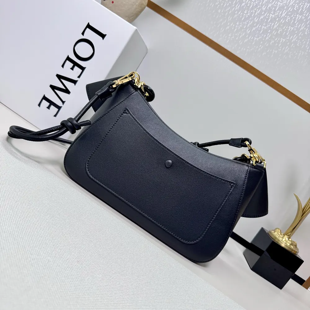 Side angle showing smooth calfskin texture on Loewe Women Medium Ola Bag