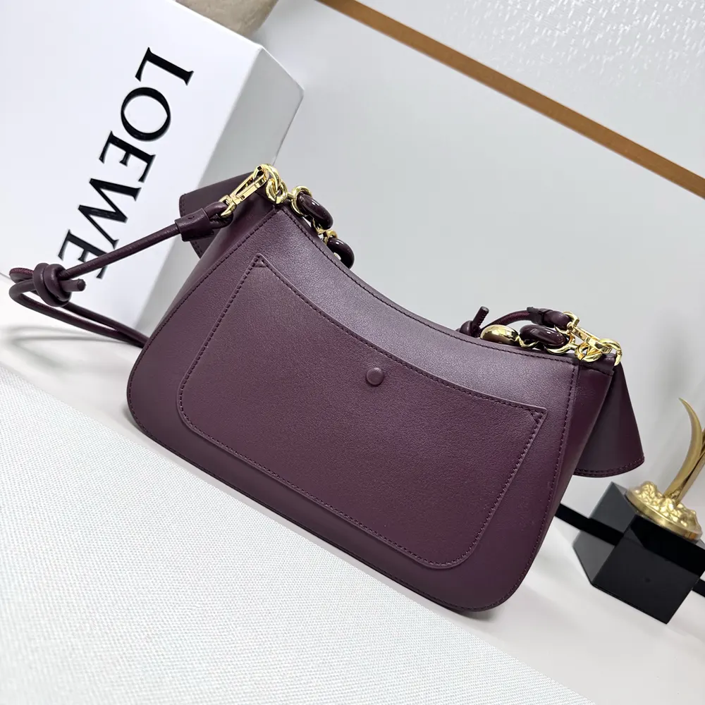 Side angle showing structured silhouette of Loewe Women Medium Ola Bag