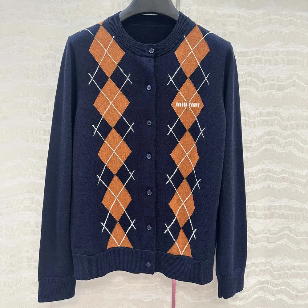 Close-up of Miu Miu Women Cashmere Cardigan button detail