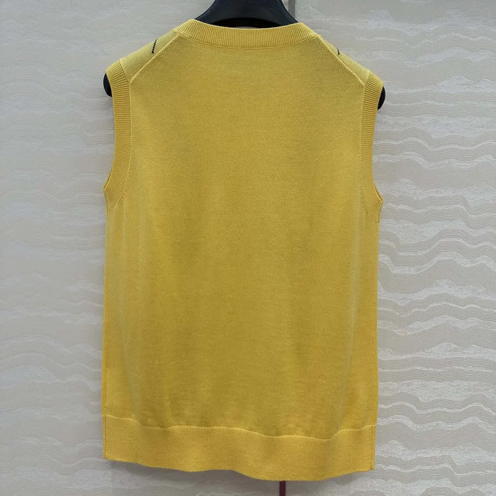 Side angle showing relaxed fit of Miu Miu Women Cashmere Vest