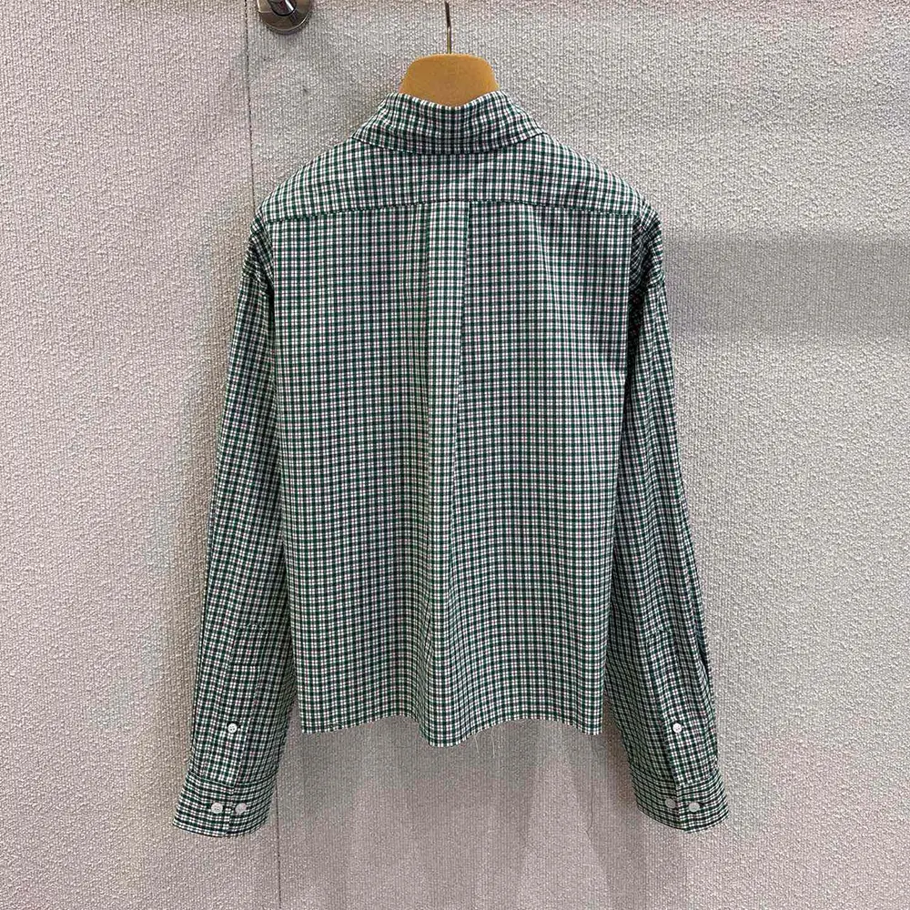 Side angle showing tailored silhouette of Miu Miu Women Checked Shirt