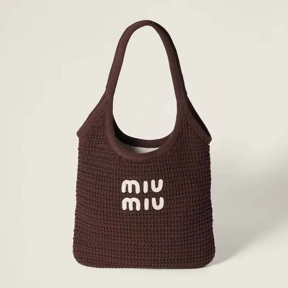 Front view of Miu Miu Women Ivy Raffia-Effect Woven Tote Bag in maroon