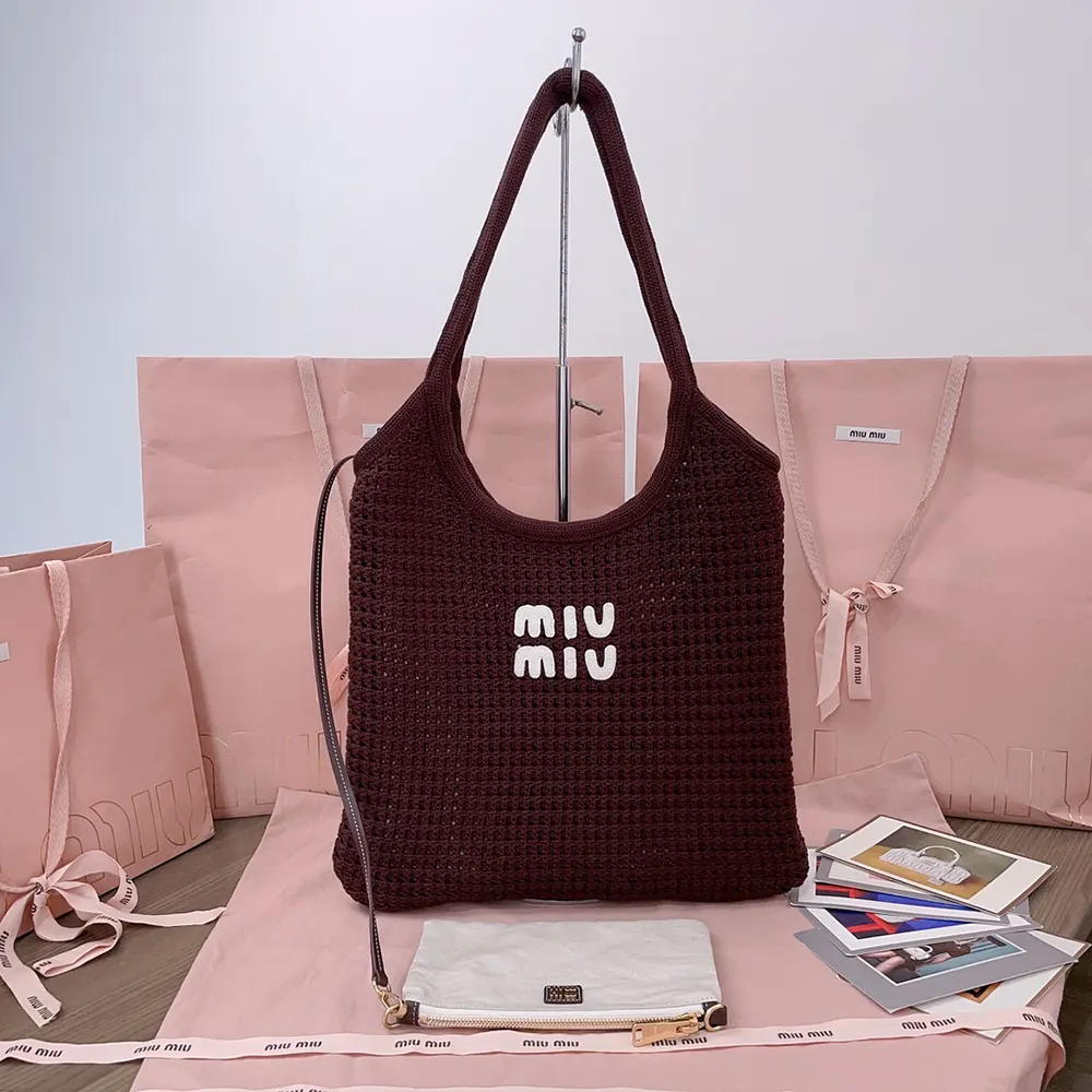 Close-up of maroon raffia-effect weave and gold hardware on Miu Miu tote