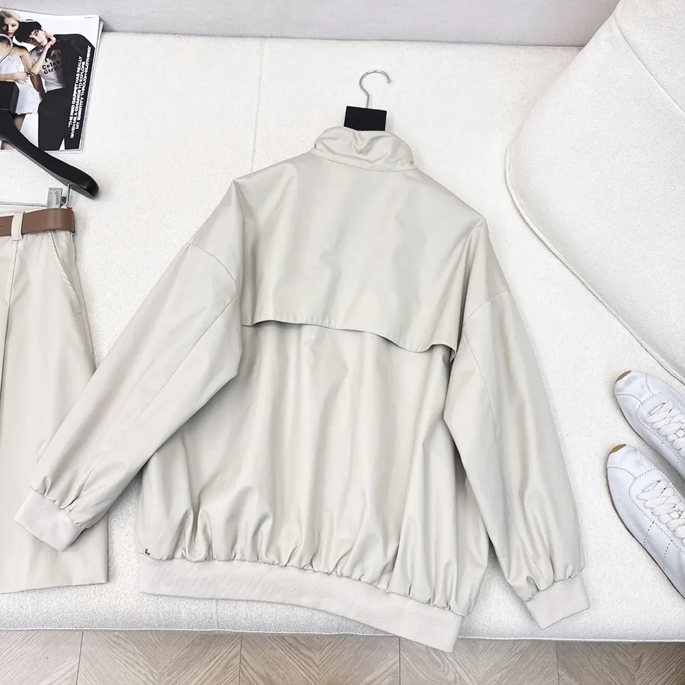 Side profile showing relaxed silhouette of Miu Miu Panama Cotton Blouson Jacket