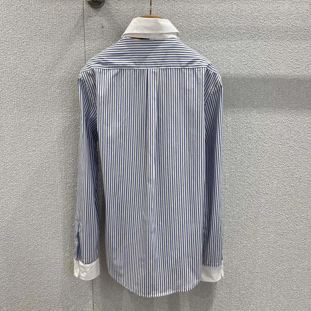 Side profile highlighting relaxed fit of Miu Miu Women Striped Poplin Shirt