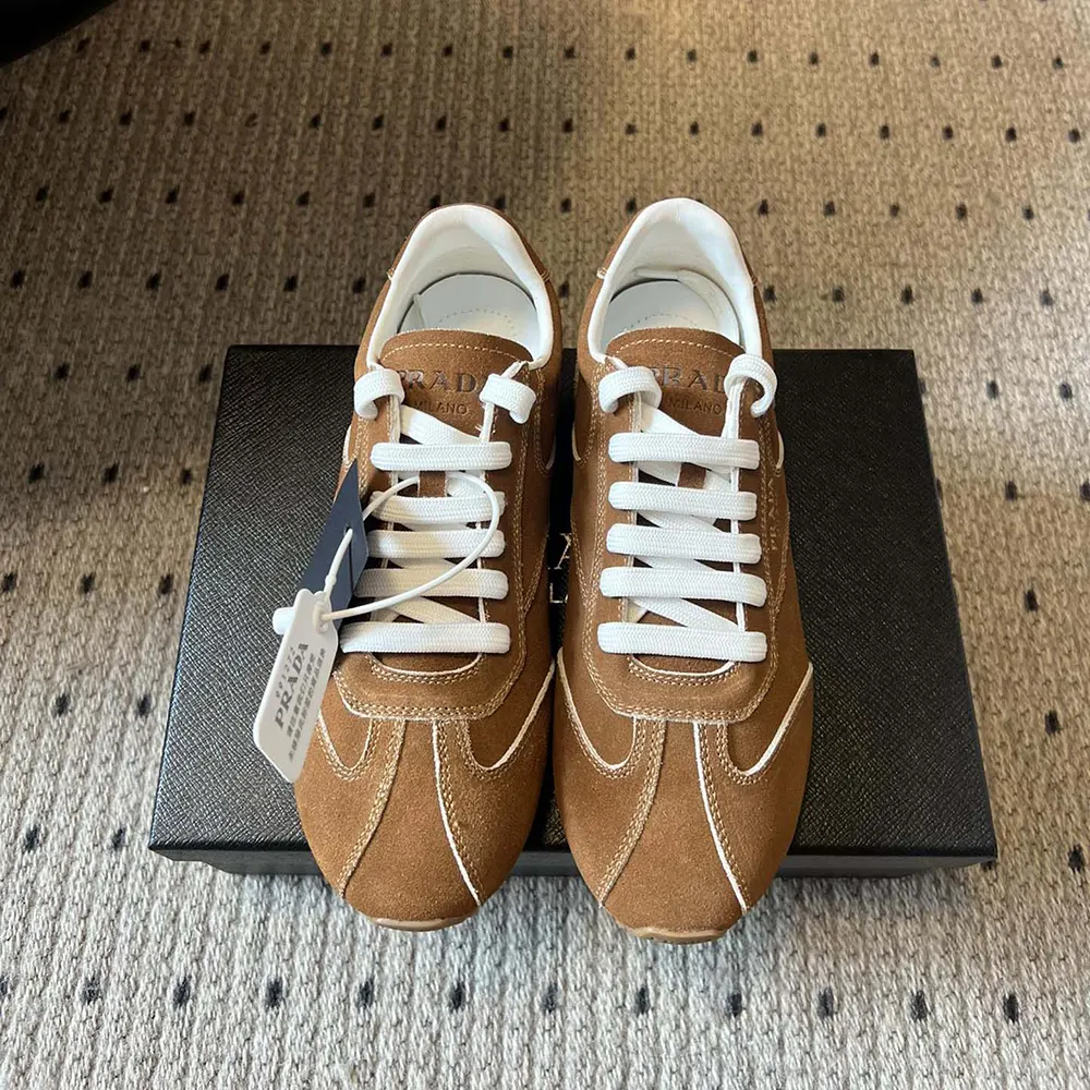 Close-up of rich suede texture and leather inserts on Prada sneakers