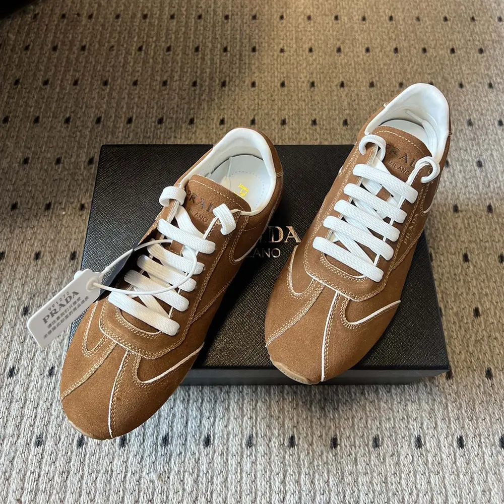Overhead shot showing lace-up closure and Prada logo hardware details