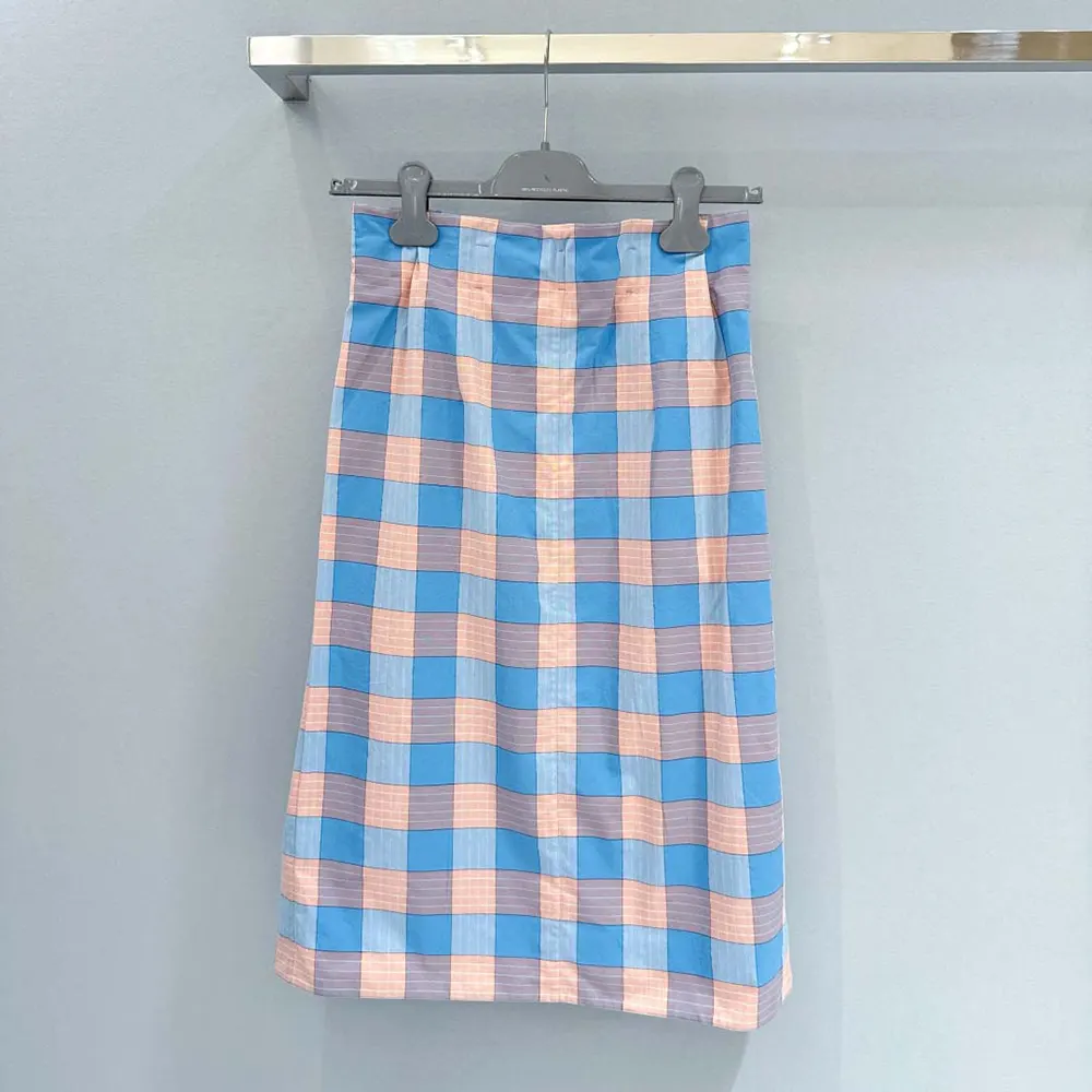 Side angle of Prada Women Checked Poplin Midi-skirt highlighting flared silhouette