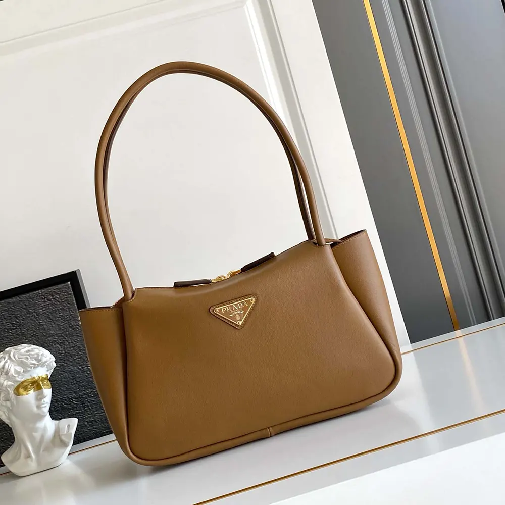 Close-up of polished gold hardware on Prada Women Darling Medium Leather Shoulder Bag-Brown