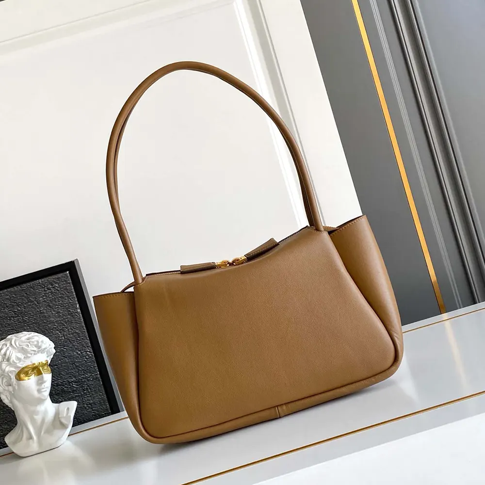 Side angle showing leather texture on Prada Women Darling Medium Leather Shoulder Bag-Brown