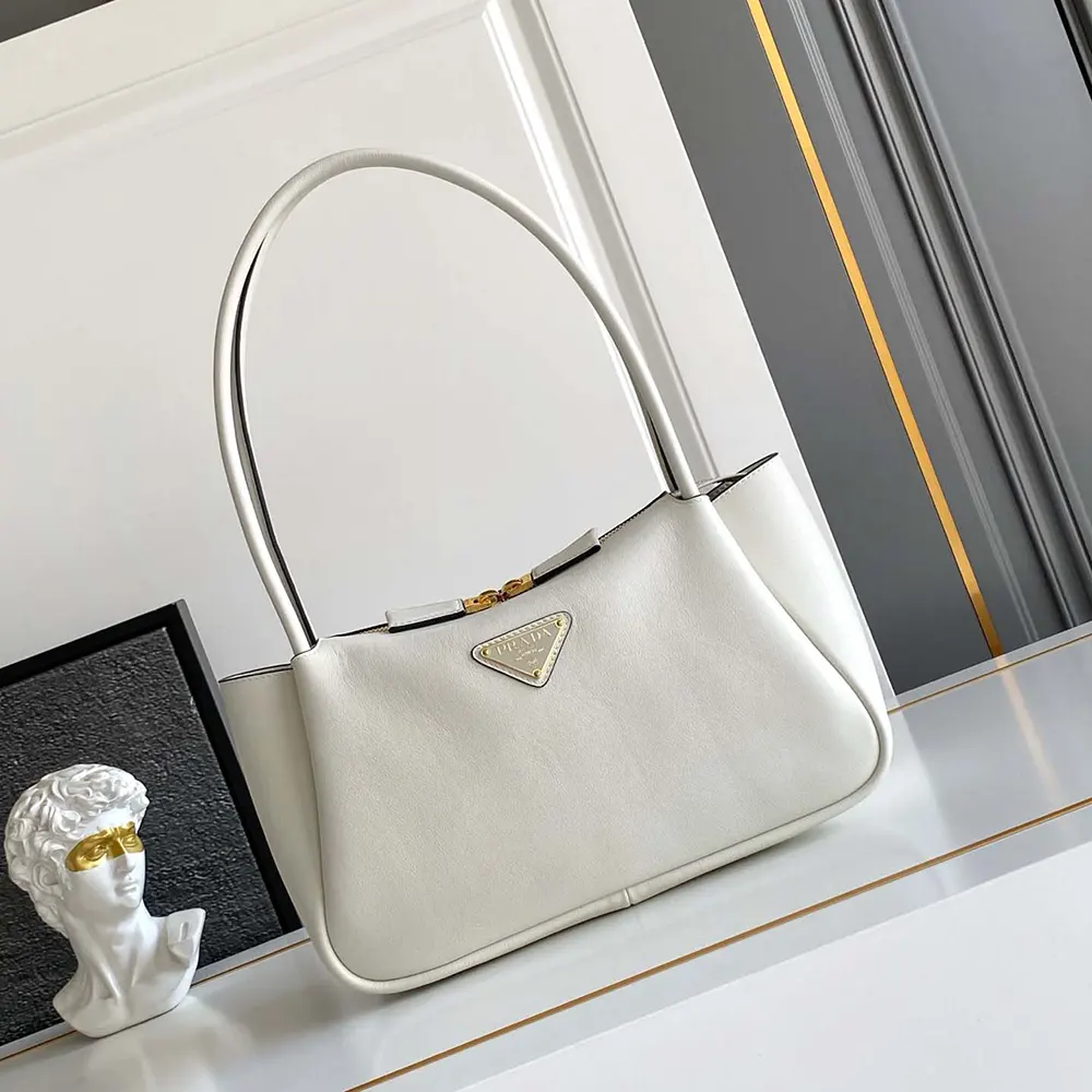 Close-up on gold-tone hardware detail on Prada Women Darling Medium Leather Shoulder Bag-White