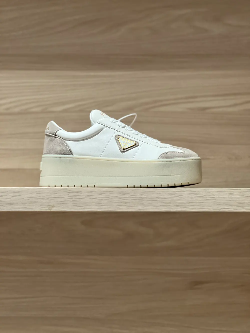Close-up of Prada logo hardware on Downtown Bold Nappa Leather And Suede Sneakers