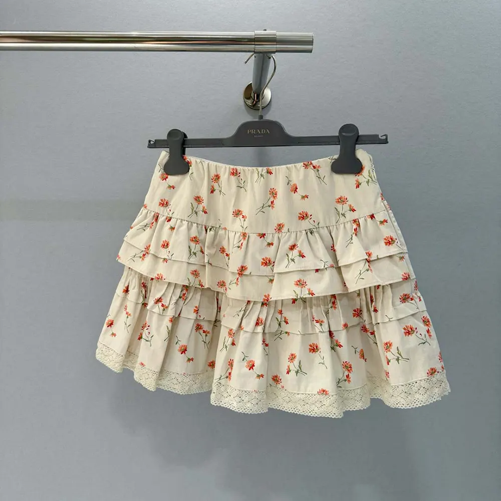 Close-up of floral print and delicate hardware on Prada miniskirt